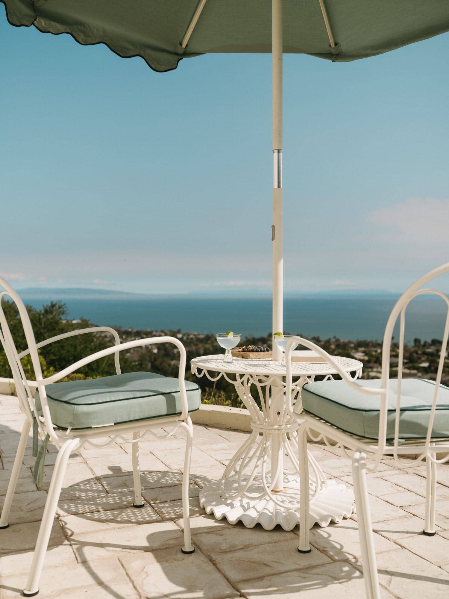 Al fresco chairs, table and umbrella on a patio