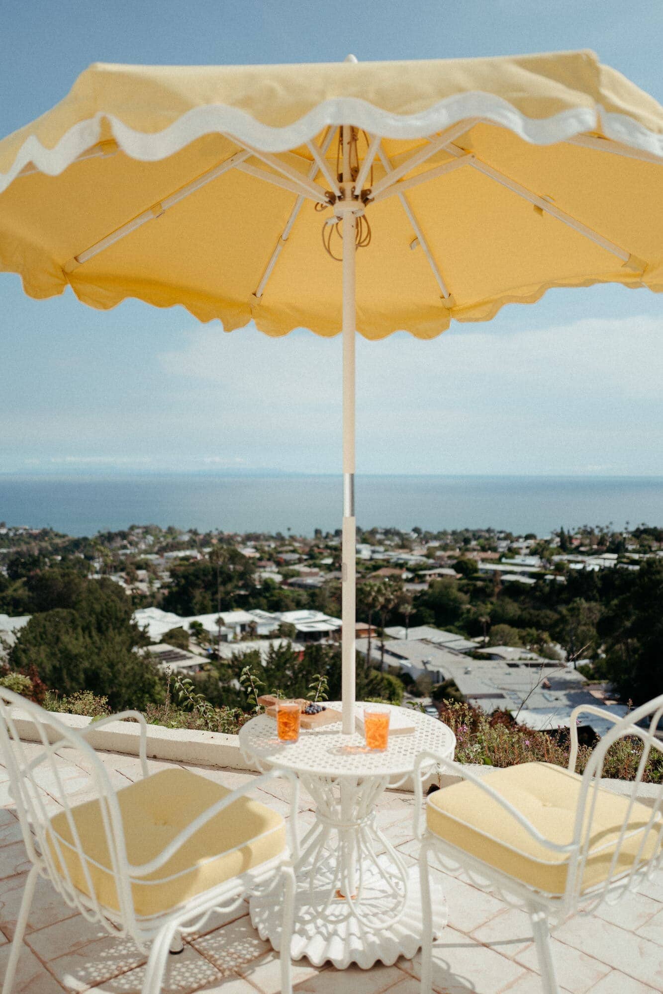 Al fresco chairs, table, and umbrella on a patio
