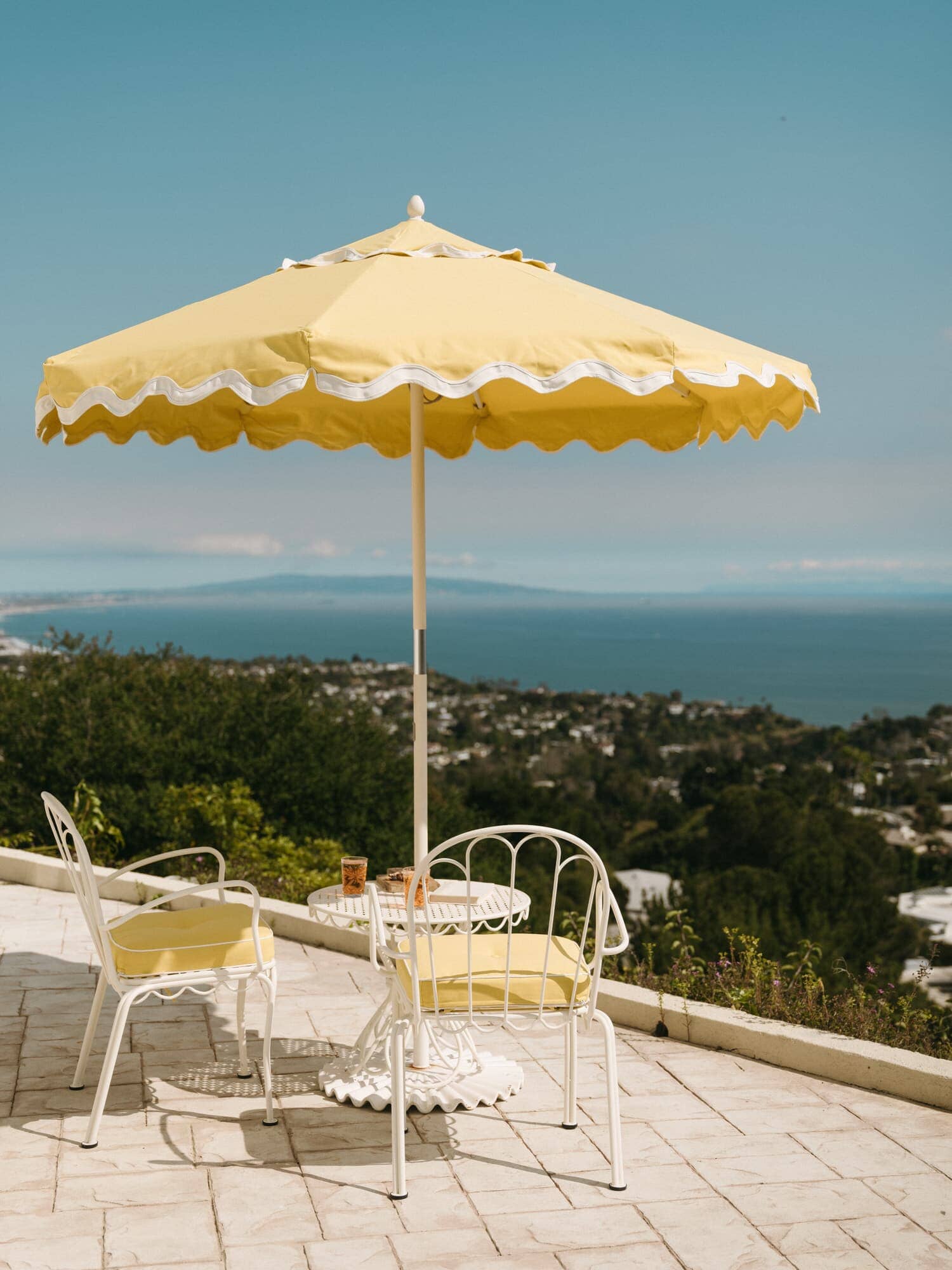 Al fresco chairs, table, and umbrella on a patio
