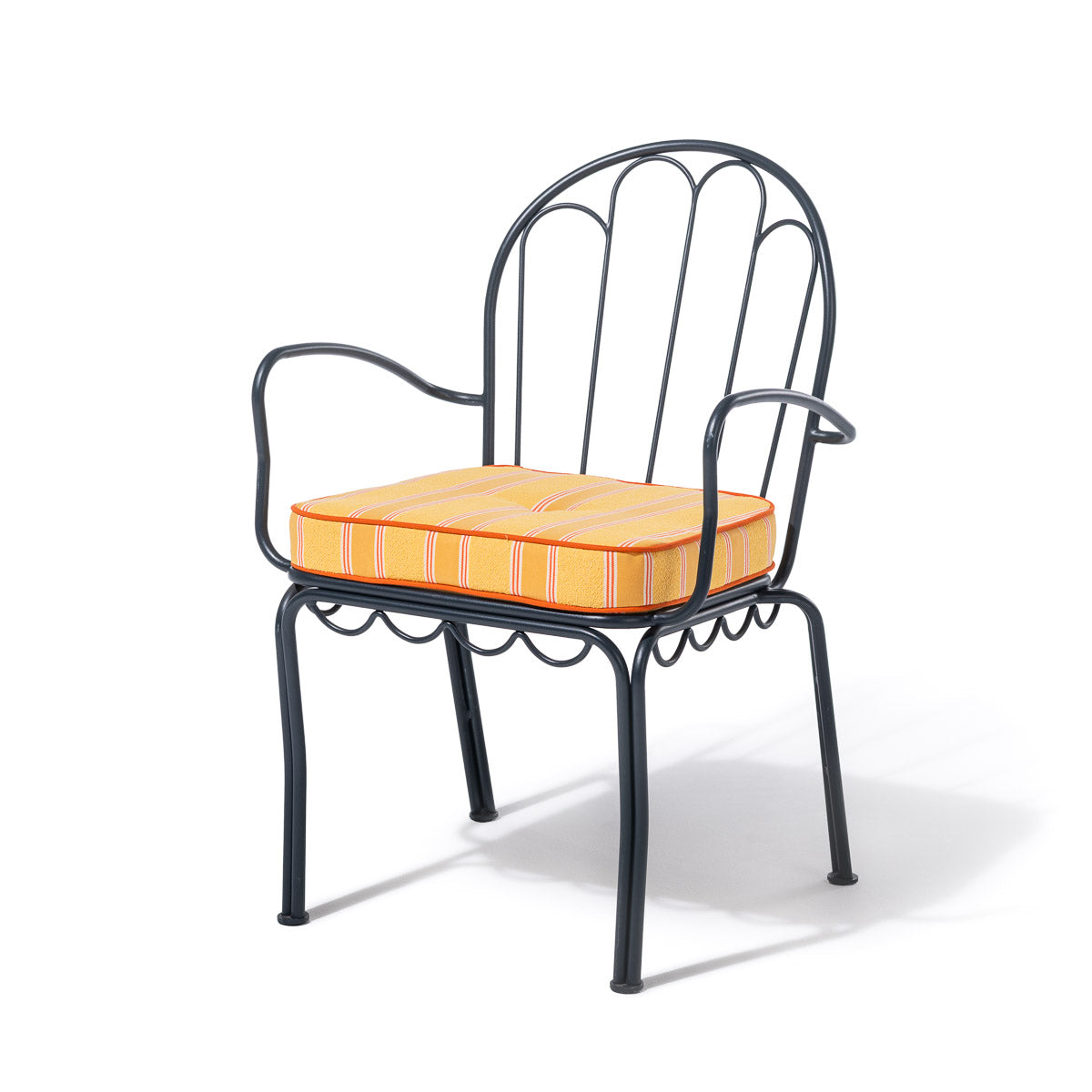 A black metal garden armchair with a curved backrest and armrests, shown with a striped orange and yellow cushion on a white background.