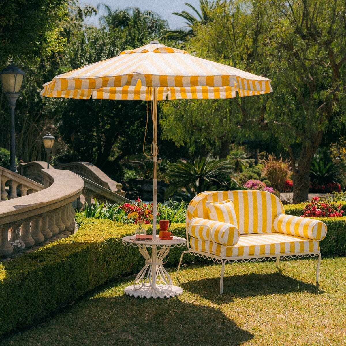 The Al Fresco Love Seat in Crew Mimosa Yellow Stripe | Antique White Frame Al Fresco Love Seat Kit Business & Pleasure Co. 