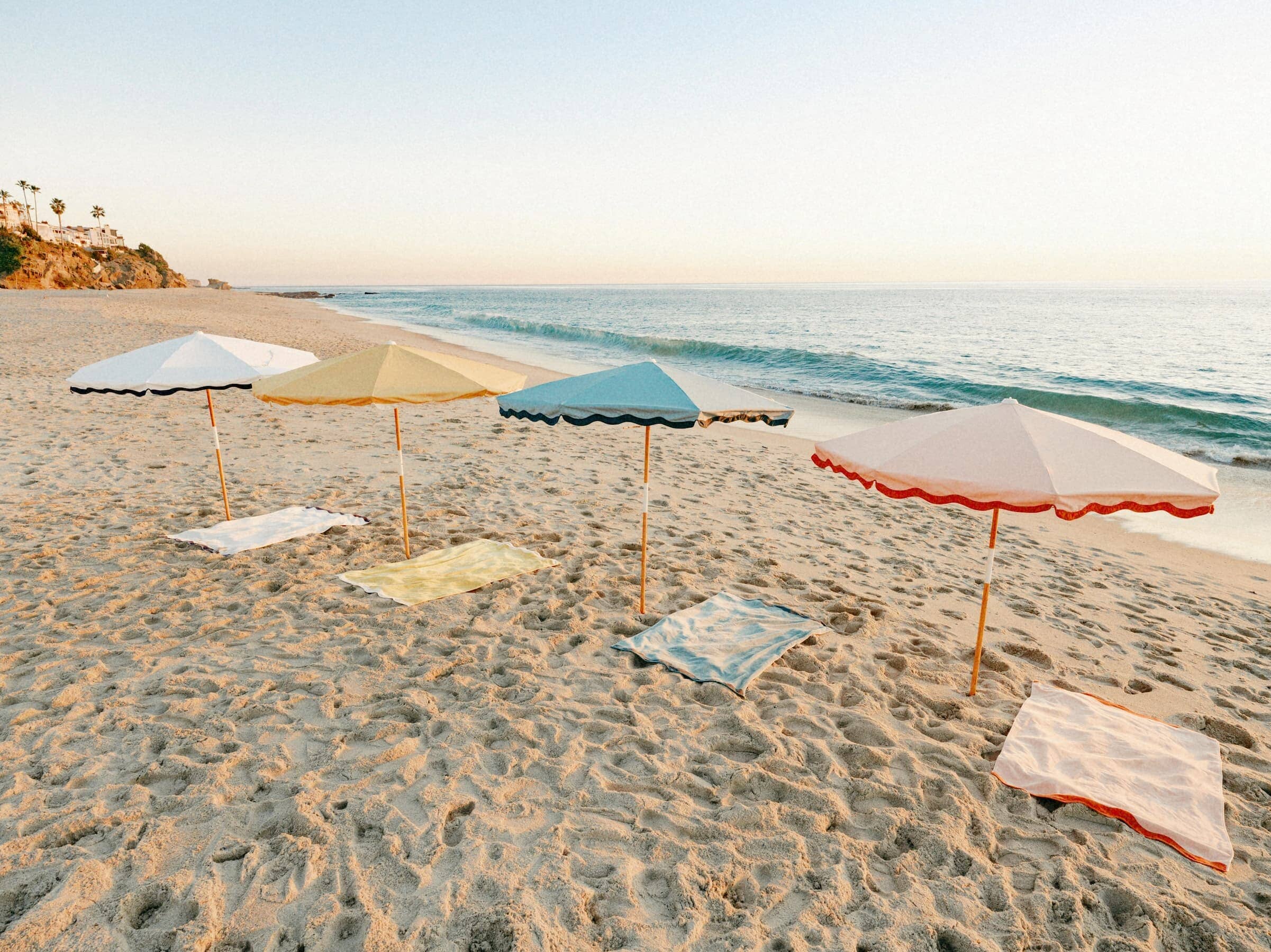All four amalfi riviera umbrellas on the beach