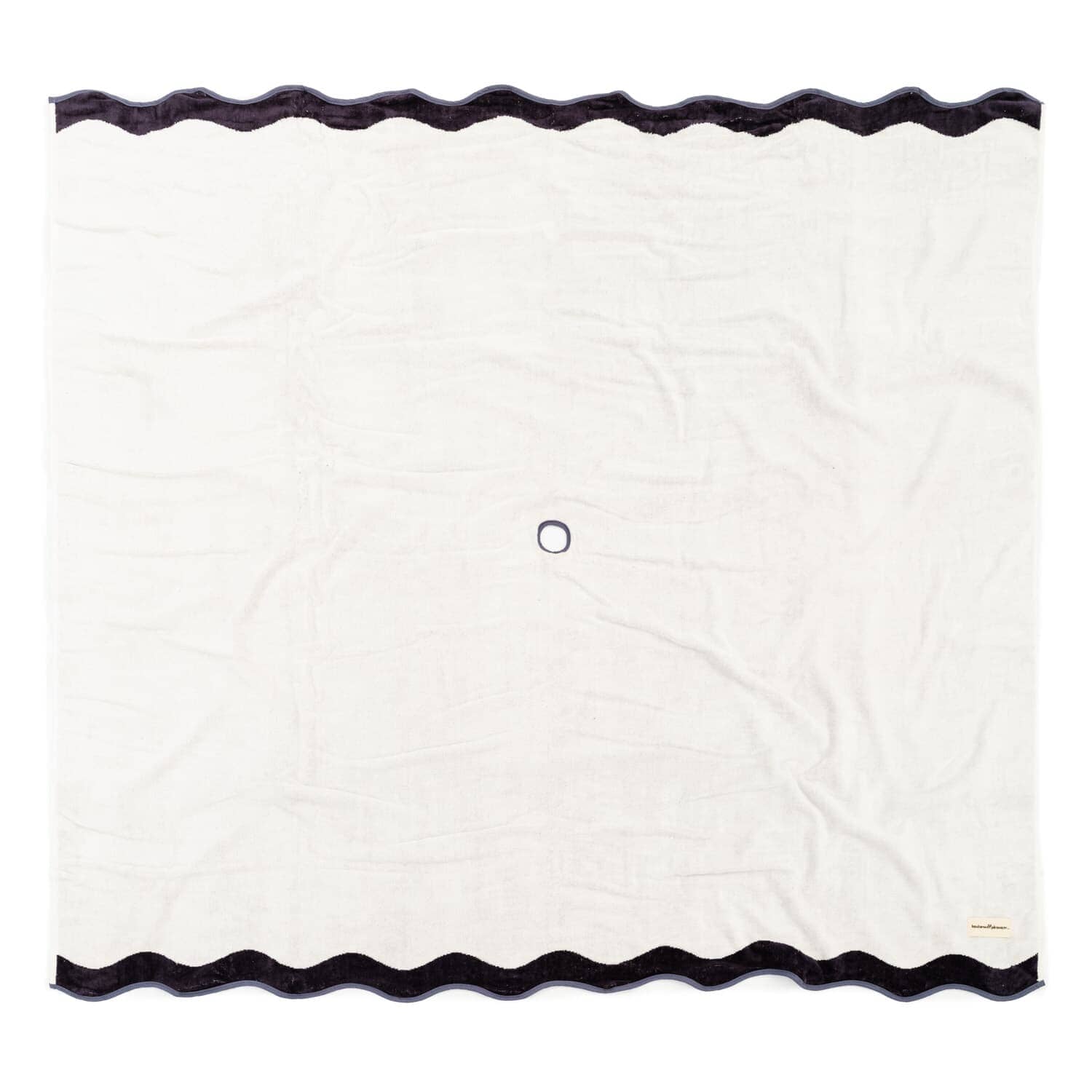 Studio image of white beach blanket