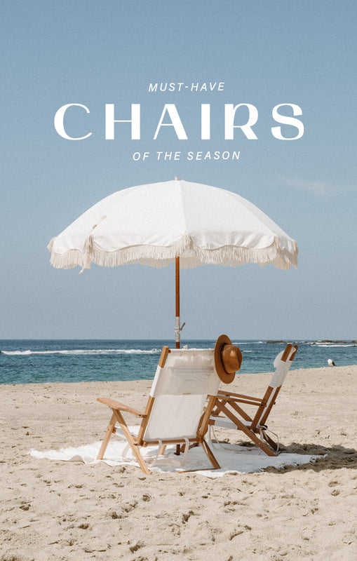 white chairs and umbrella on a beach