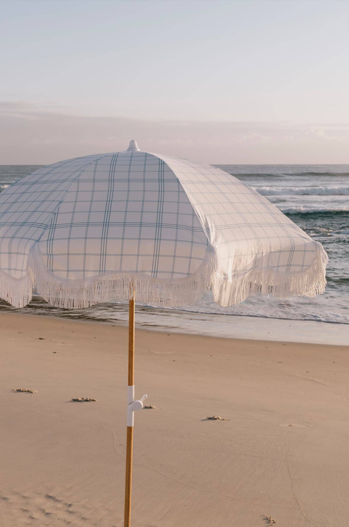 Plaid umbrella on the beach