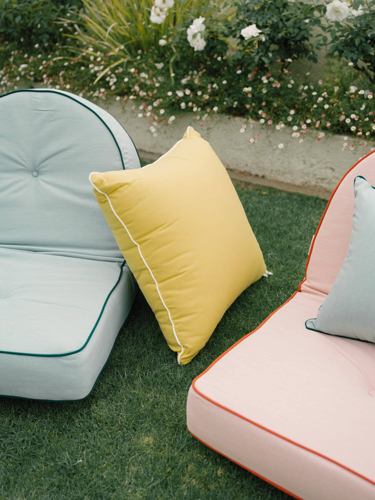 Riviera green and pink reclining loungers in a garden setting