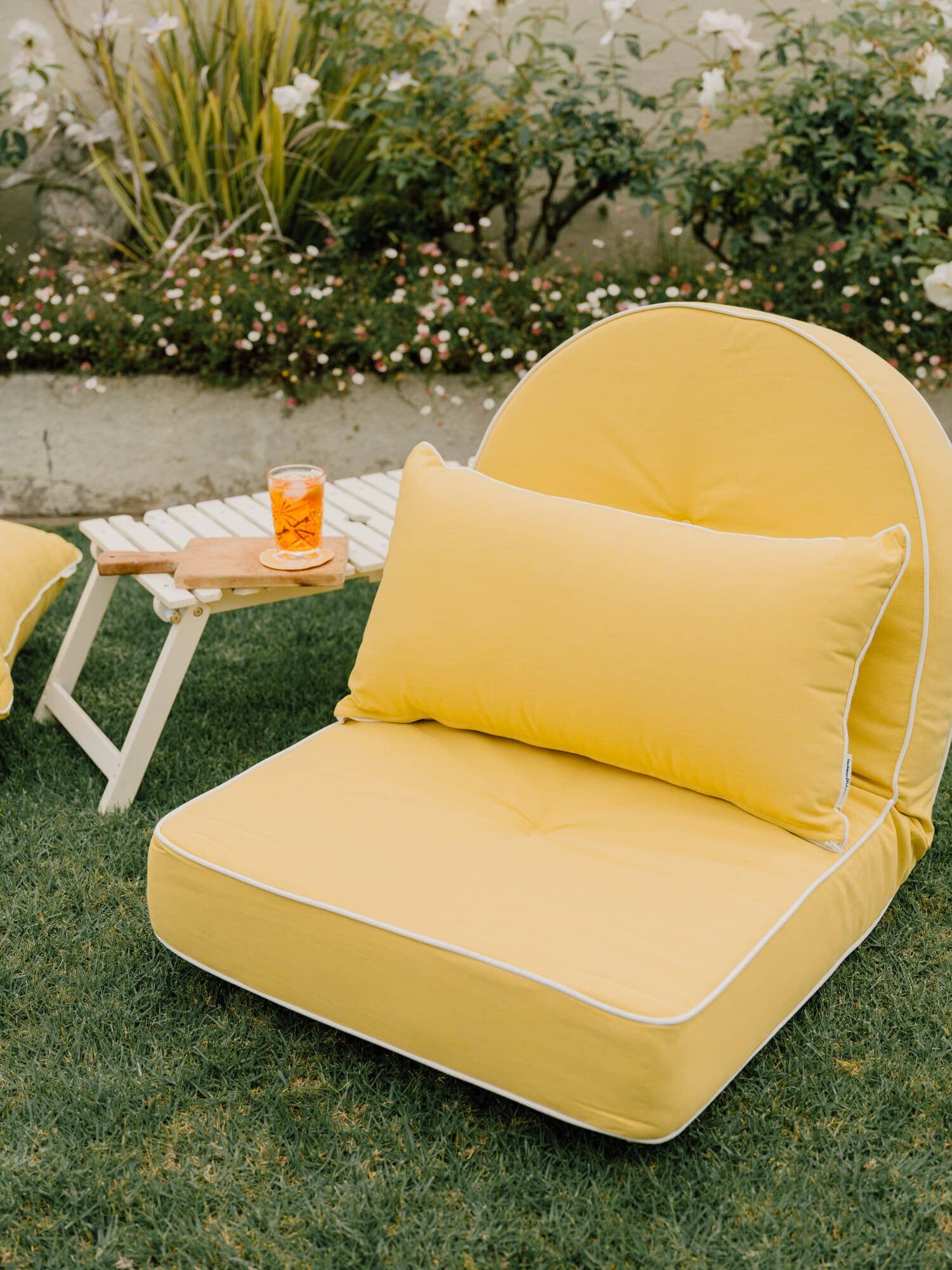 Riviera mimosa reclining lounger in a garden setting
