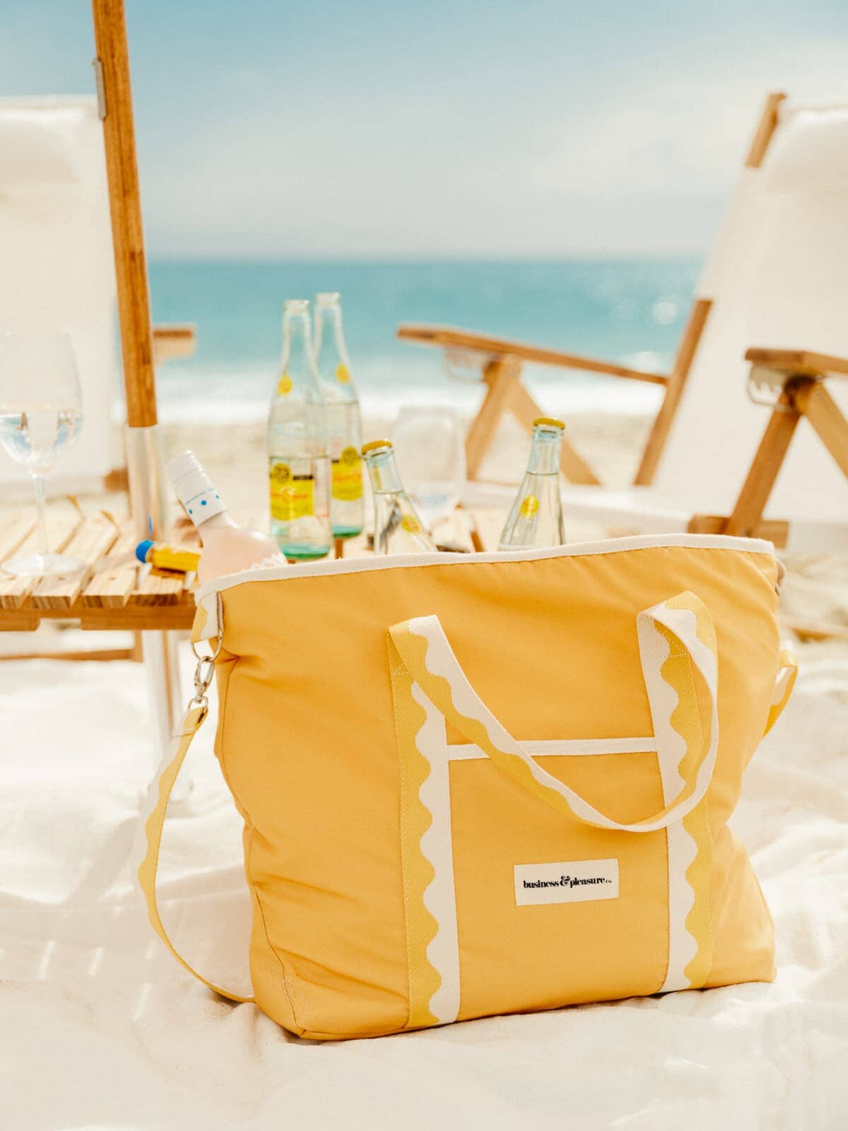Riviera mimosa cooler tote bag on the beach