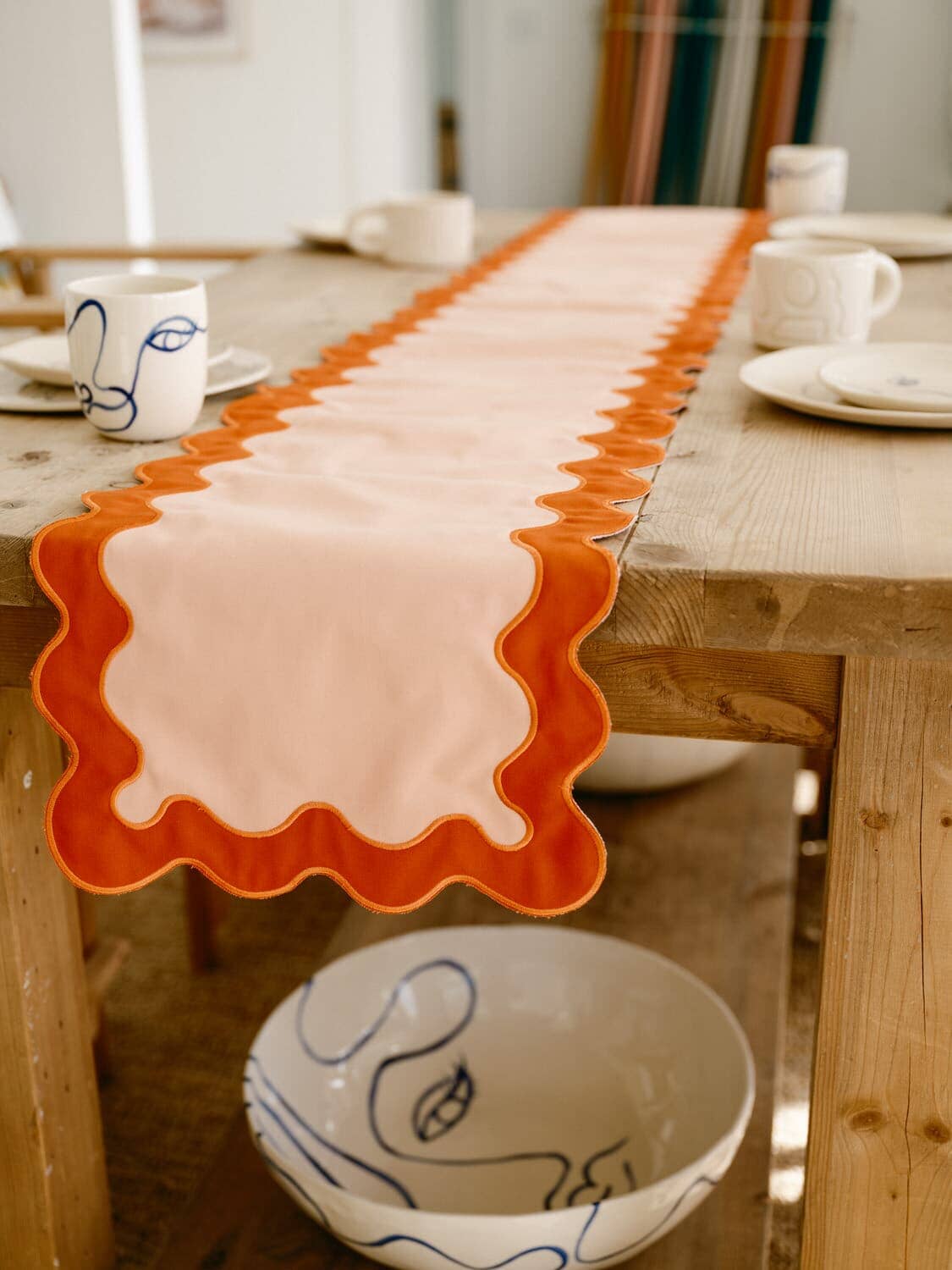 Riviera Pink table runner on a table