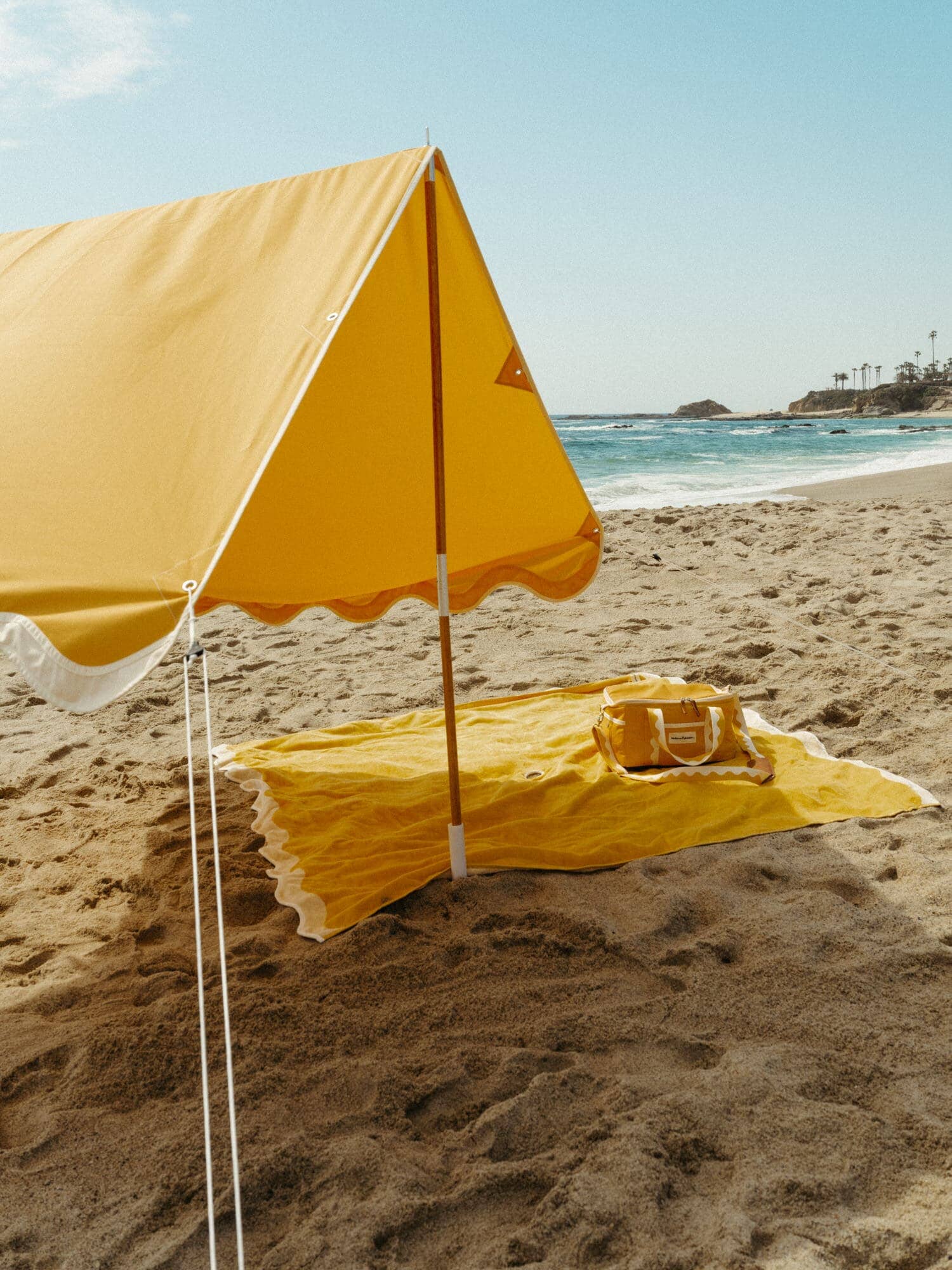 Riviera mimosa tent on the beach, with blanket & cooler