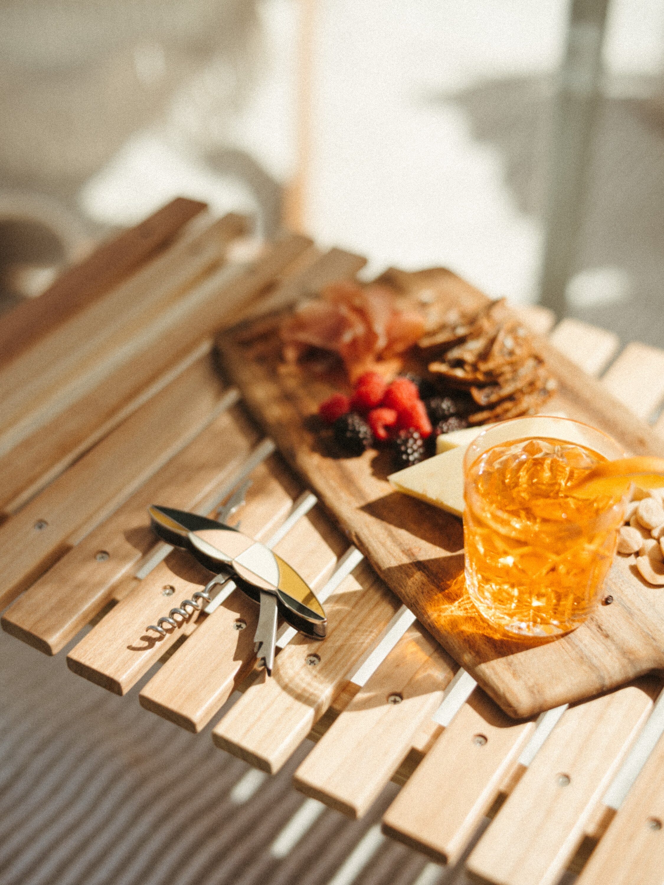 Picnic table with bottle opener, cocktail and cheese board
