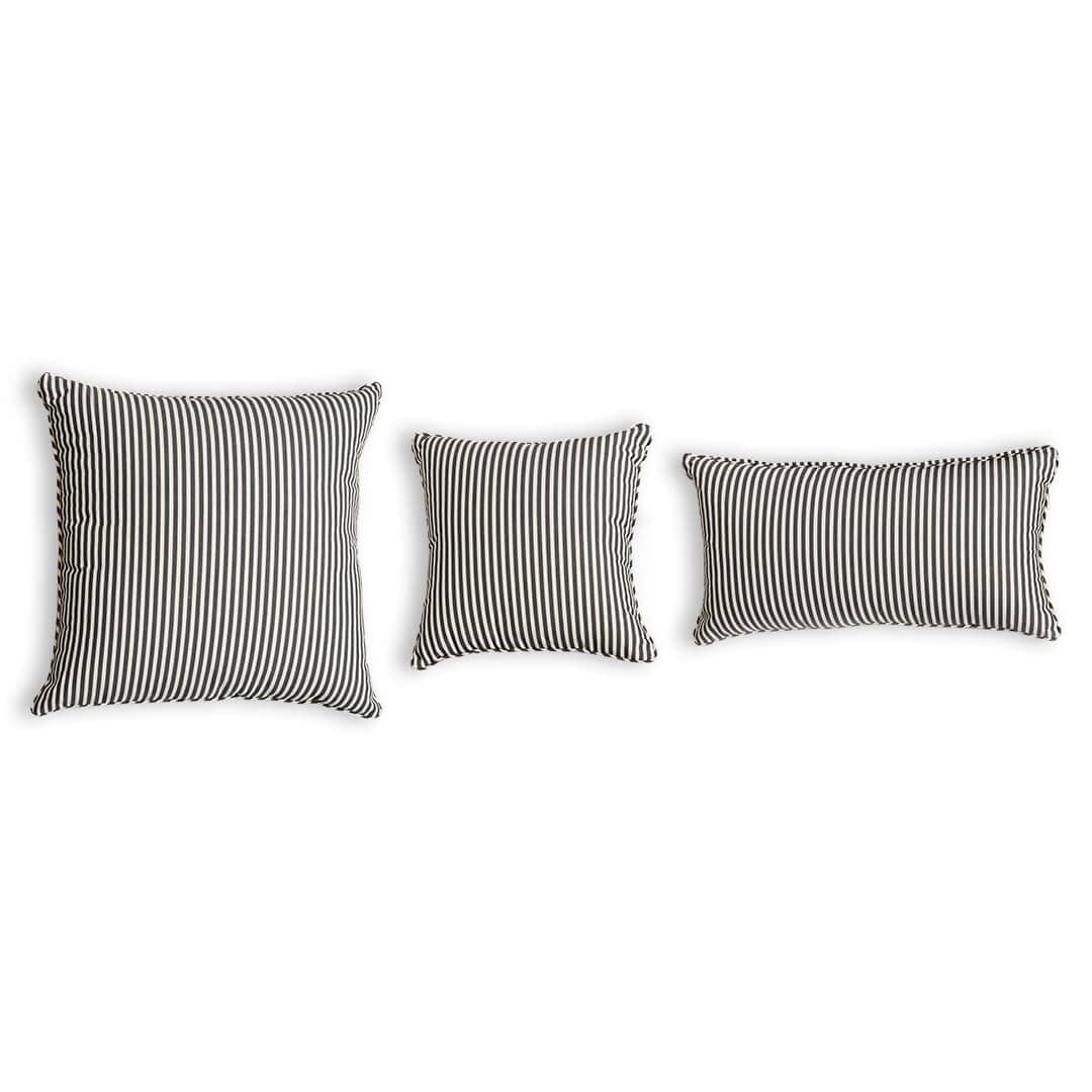 studio image of 3 different size throw pillows